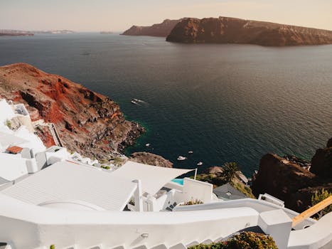 Santorini Villas That Disappear Into White Stone Cliffs